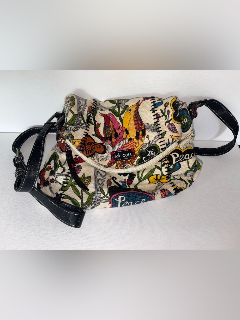 Sakroots Peace Crossbody Bag in Cream with Multicolor Print